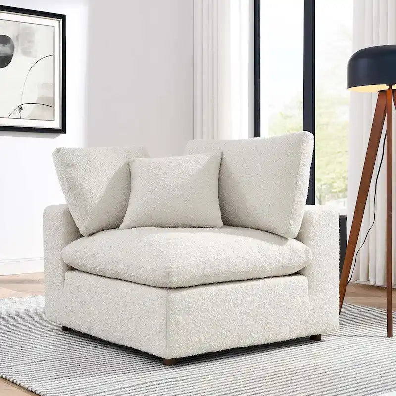 Fauteuil d'angle en tissu bouclé surrembourré, garni de duvet Commix