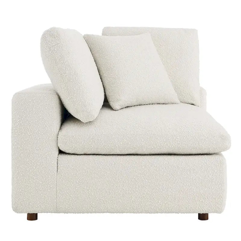 Fauteuil d'angle en tissu bouclé surrembourré, garni de duvet Commix