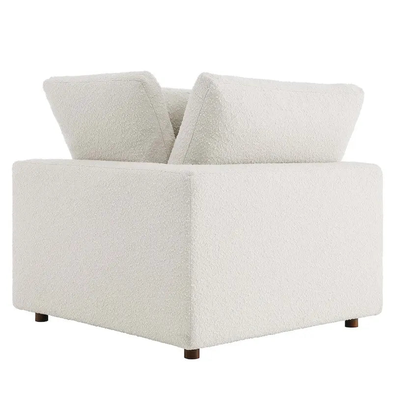 Fauteuil d'angle en tissu bouclé surrembourré, garni de duvet Commix