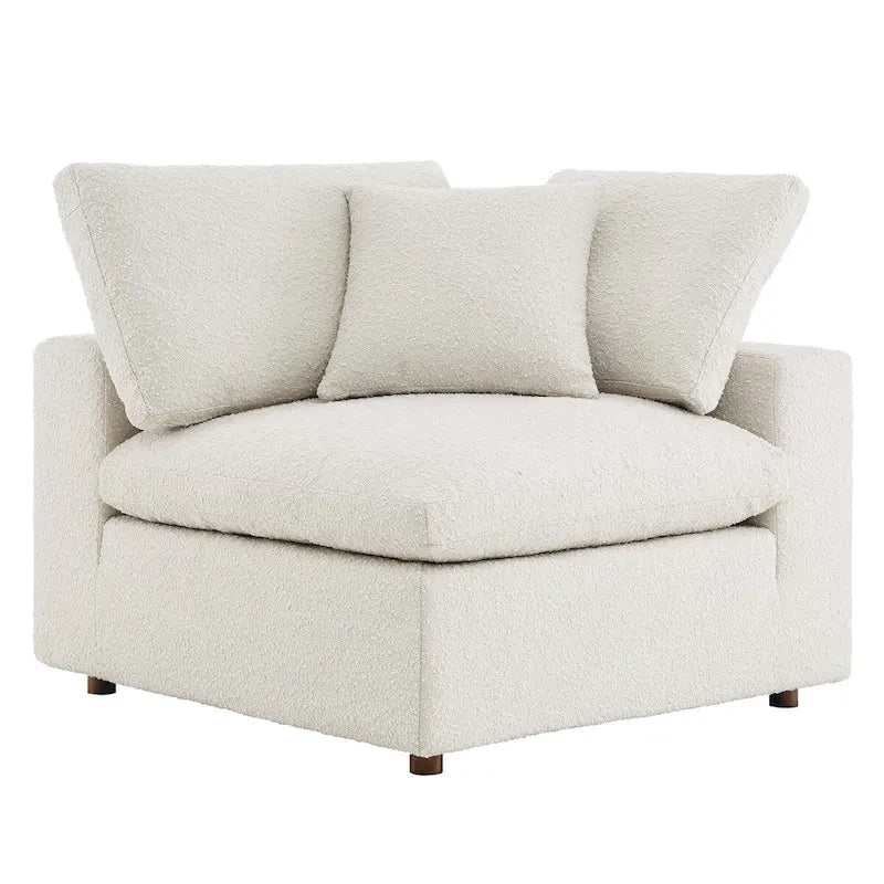 Fauteuil d'angle en tissu bouclé surrembourré, garni de duvet Commix