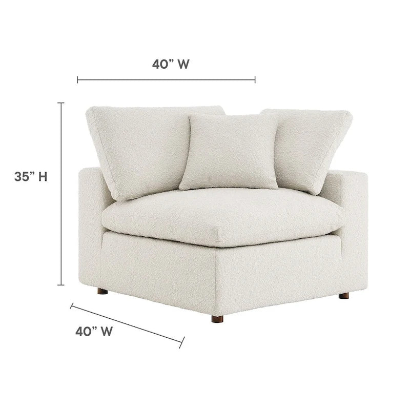 Fauteuil d'angle en tissu bouclé surrembourré, garni de duvet Commix