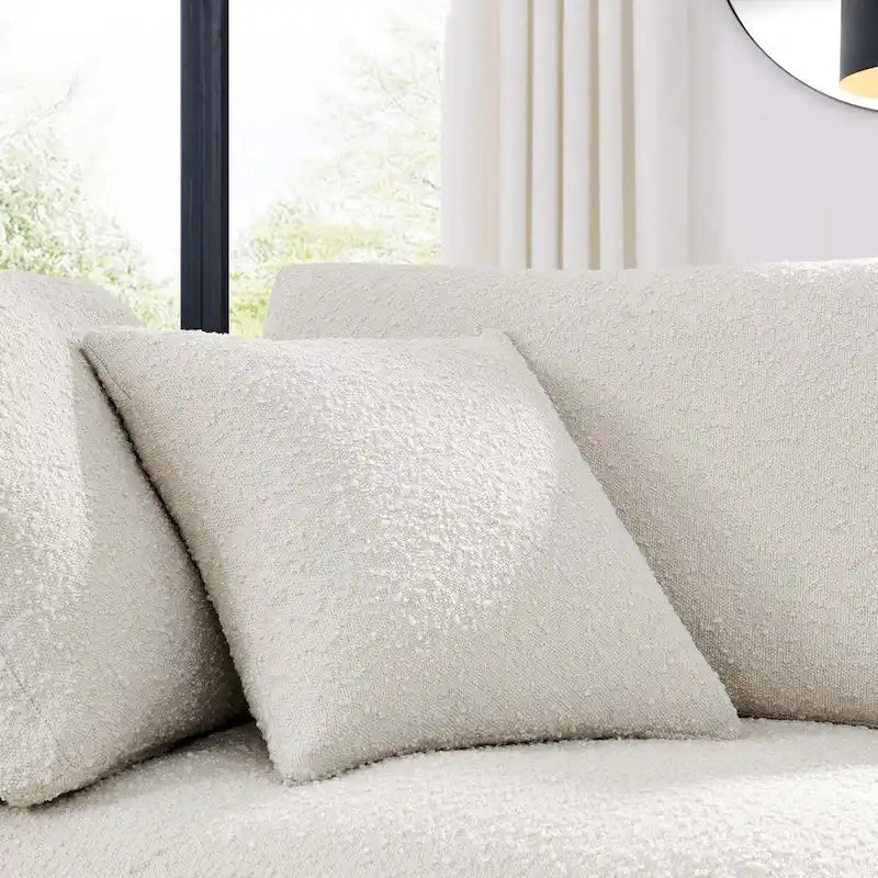 Fauteuil d'angle en tissu bouclé surrembourré, garni de duvet Commix