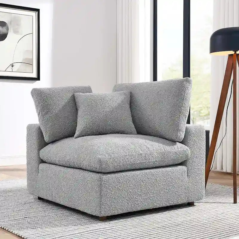 Fauteuil d'angle en tissu bouclé surrembourré, garni de duvet Commix