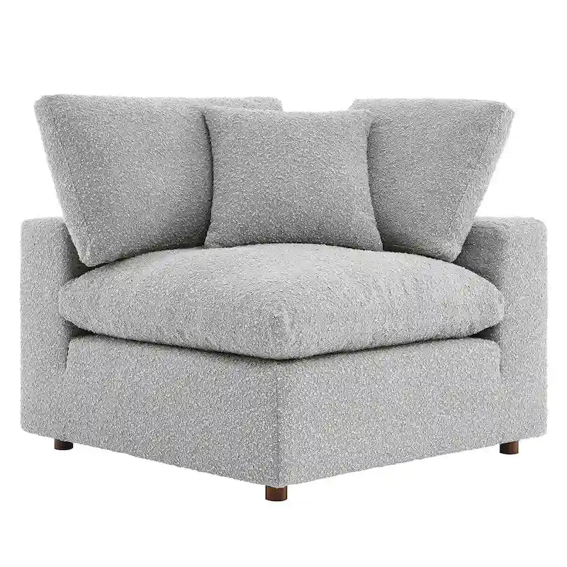 Fauteuil d'angle en tissu bouclé surrembourré, garni de duvet Commix